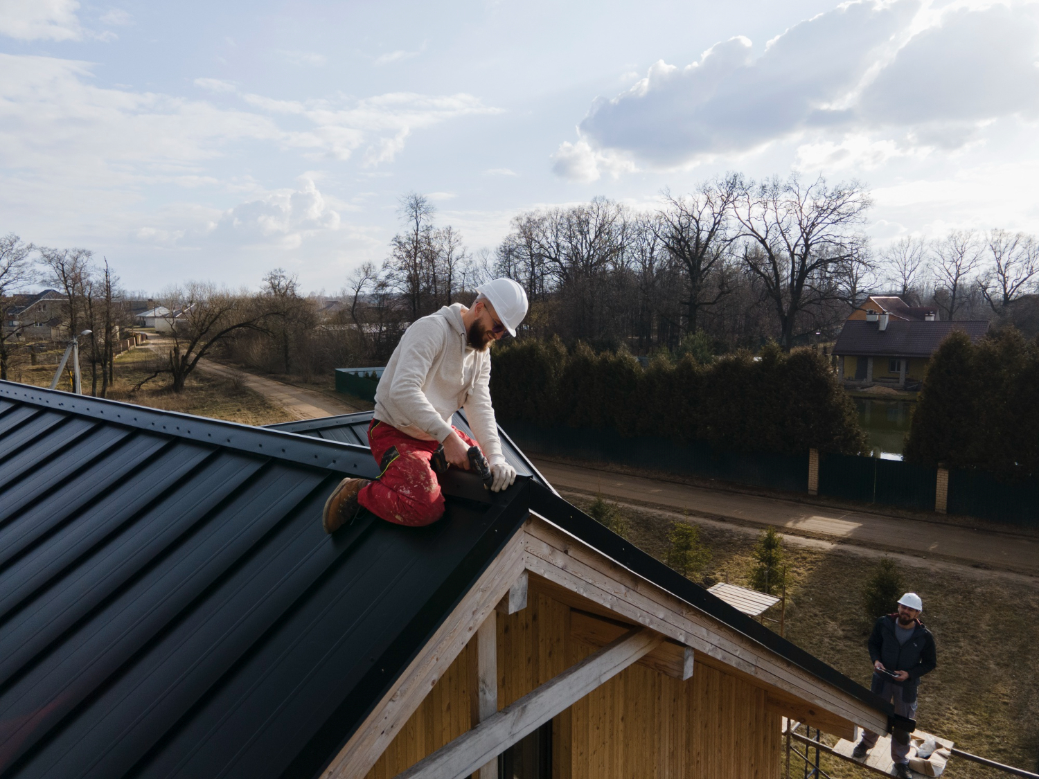 Roof professionals working on a residential roof